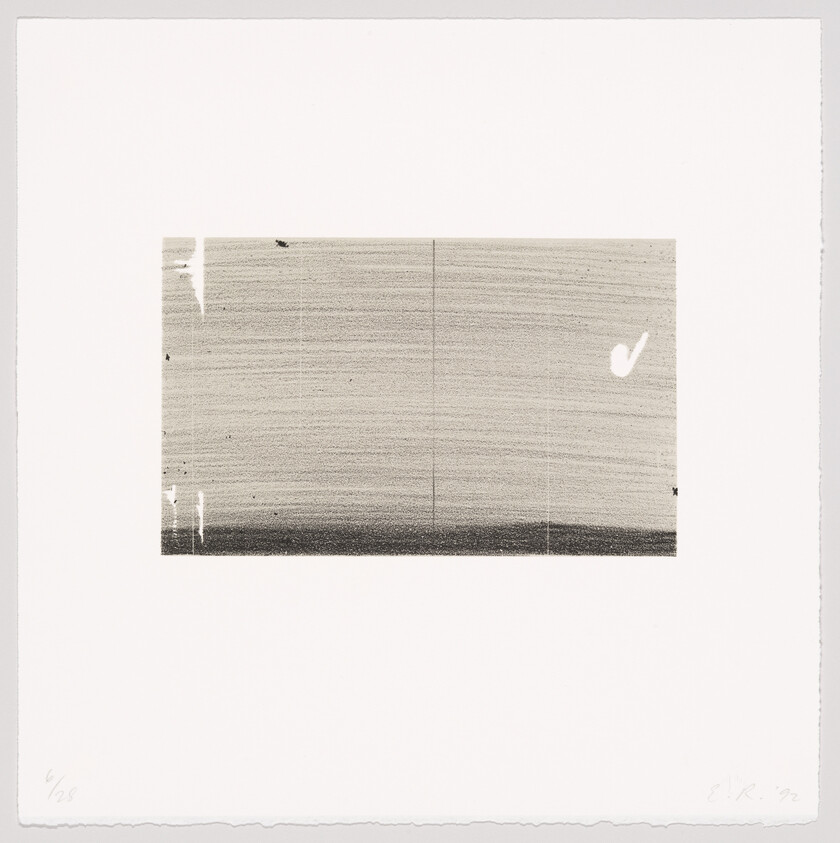 A rectangular grayscale print with fine horizontal lines, a dark lower band, and a small white blotch.