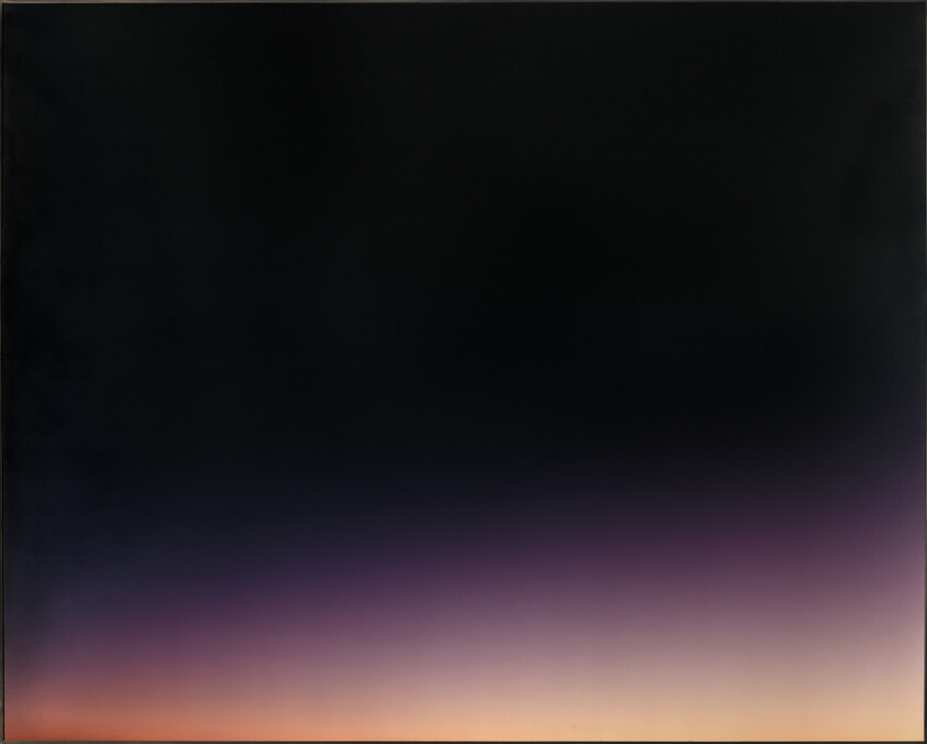 Dark sky fades into purple and orange near the horizon, suggesting dawn or dusk.