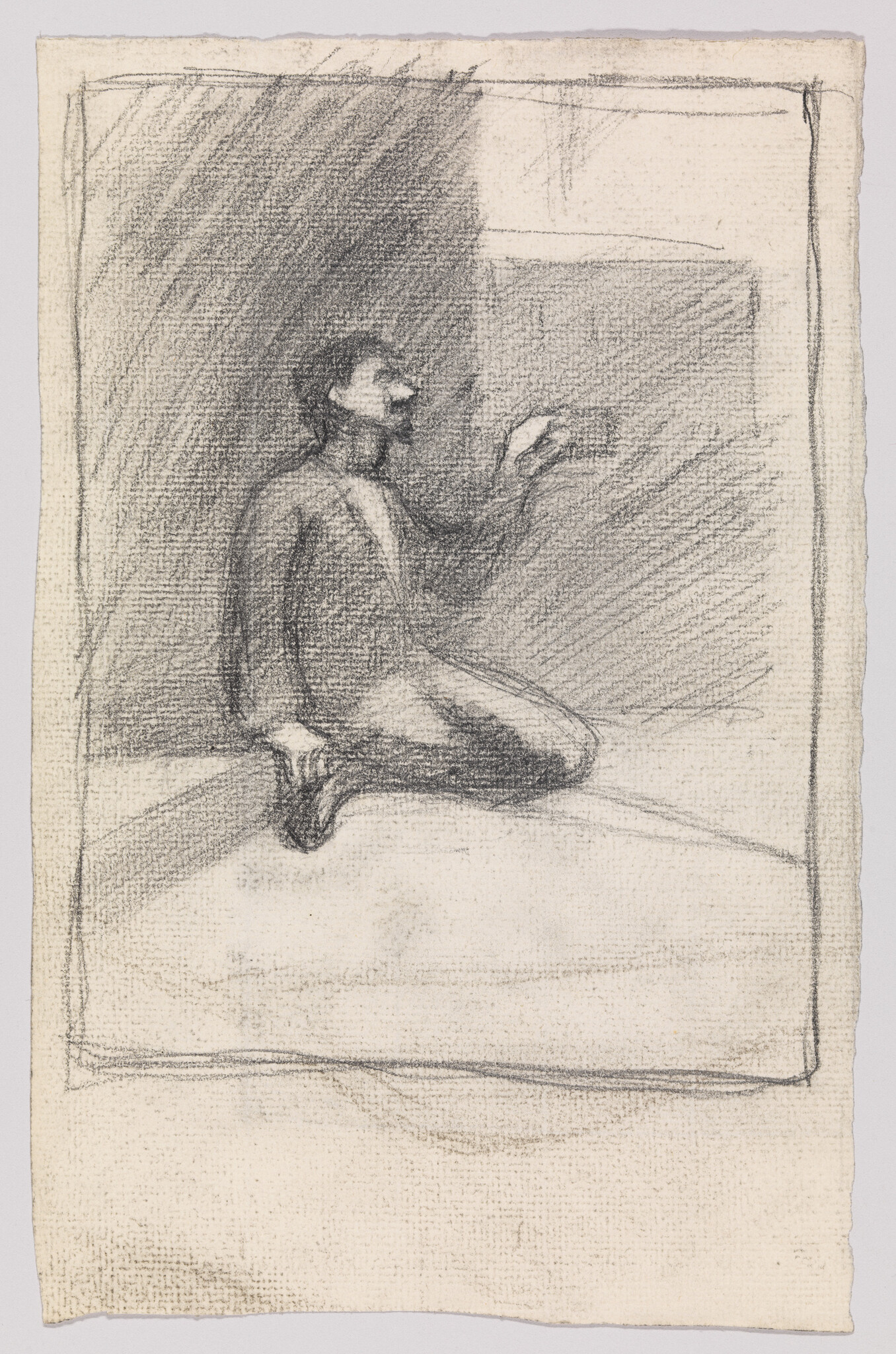 A kneeling man holds a small object in his raised hand against a shaded background.