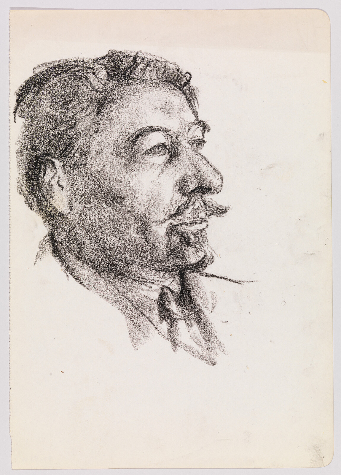 A charcoal portrait of a mustached man in profile gazing to the right.