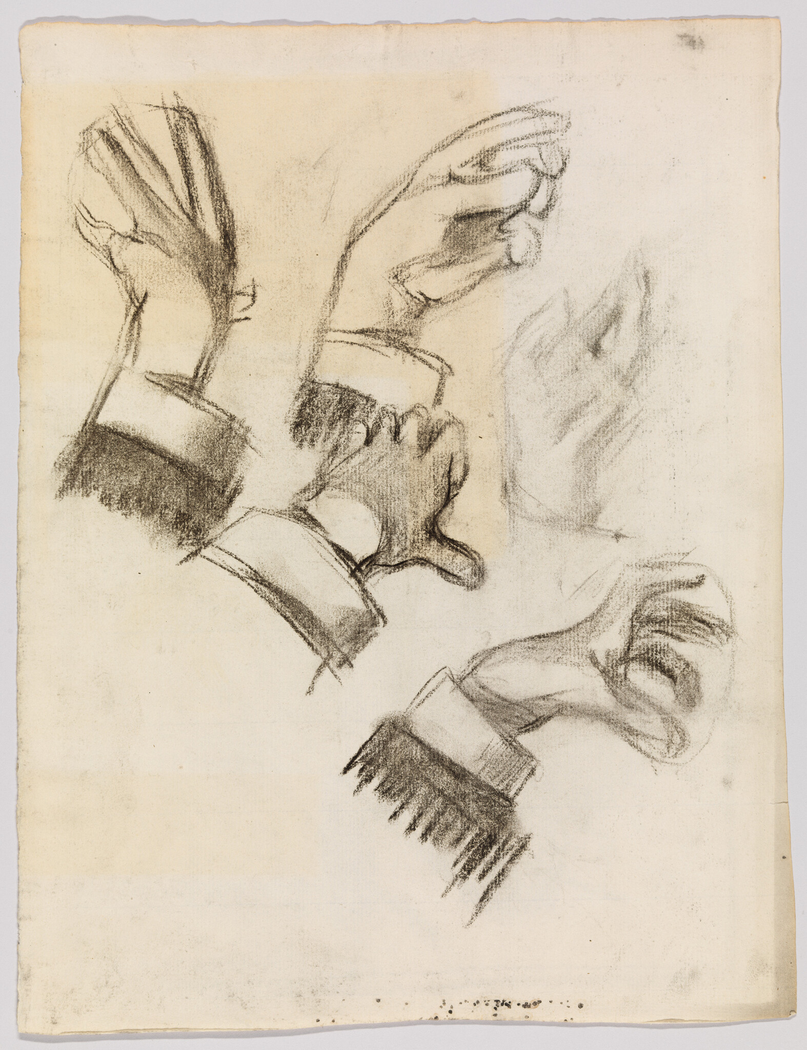 Several charcoal sketches show hands in different gestures with thick shirt cuffs.