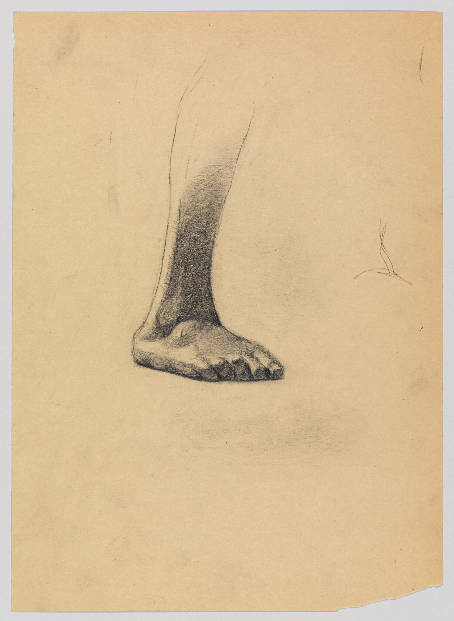 A charcoal study of a bare human foot and lower leg resting on blank paper.