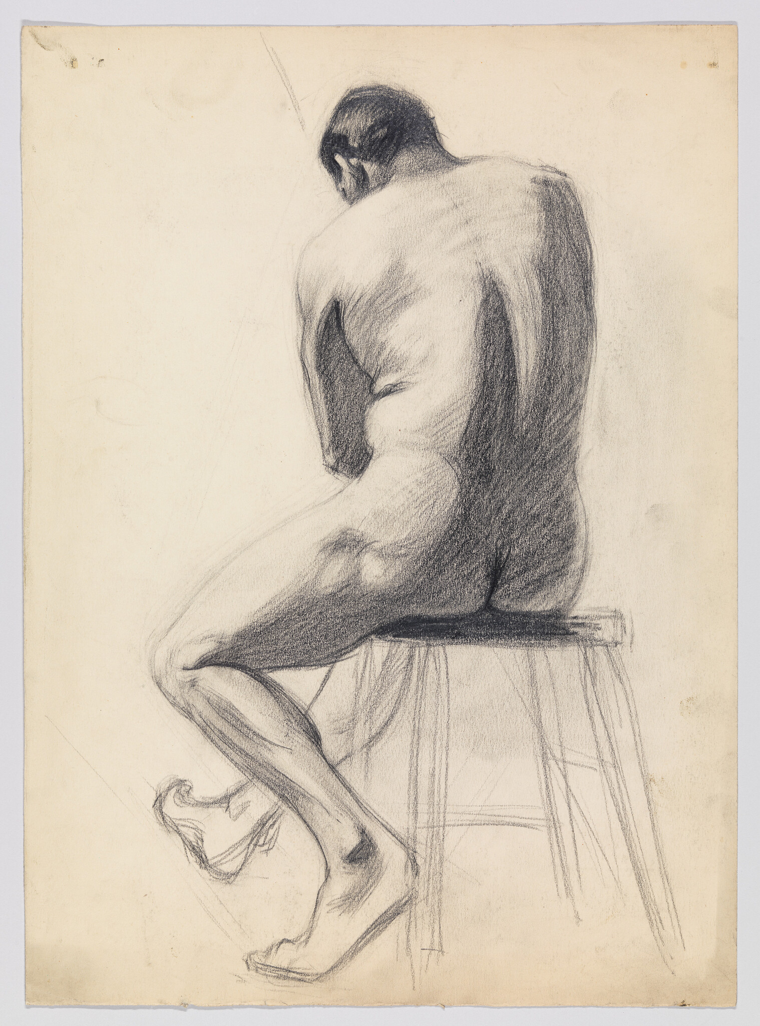 Charcoal sketch of a seated nude man seen from behind, hunched over on a stool.