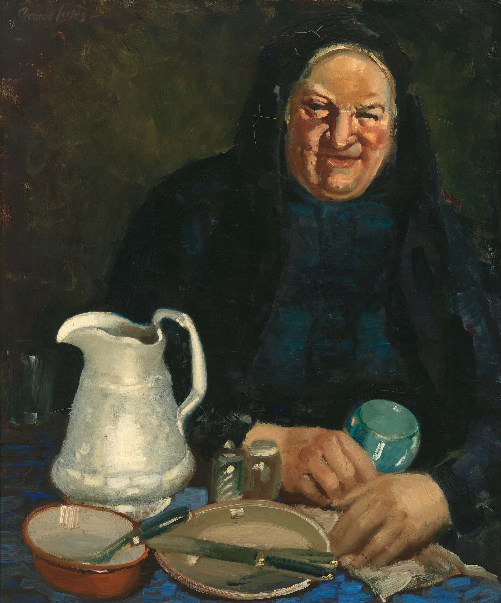 An elderly woman in a dark headscarf sits at a table with a white pitcher and dishes.