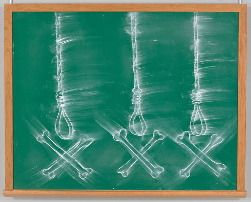 Three chalk-drawn nooses hang above crossed bones on a green classroom chalkboard.