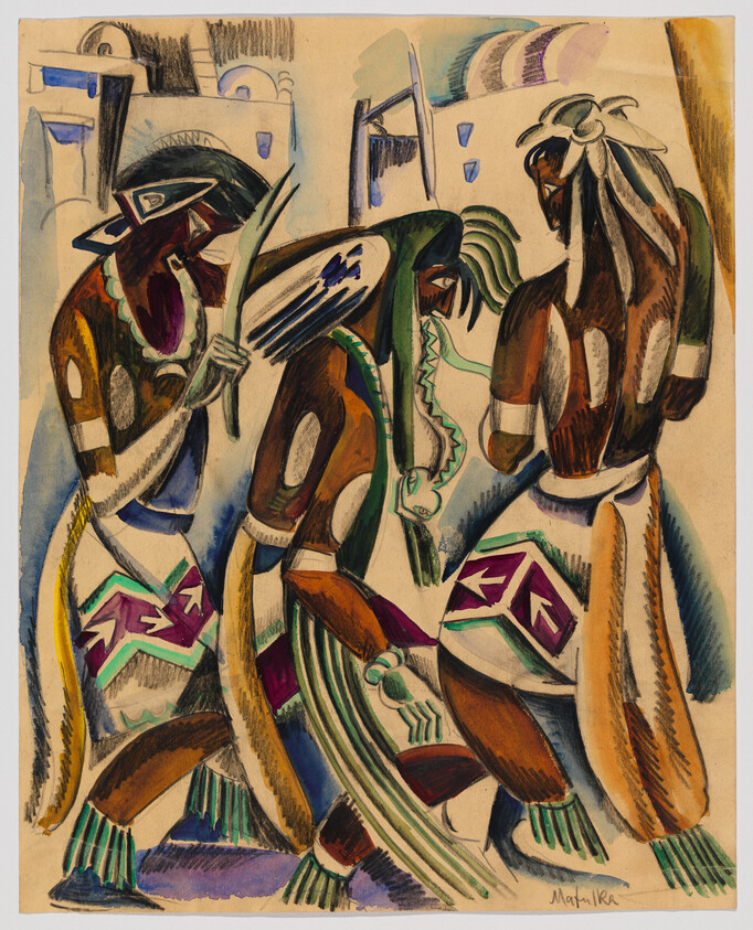 Three dancers in colorful patterned regalia performing a ceremonial dance.