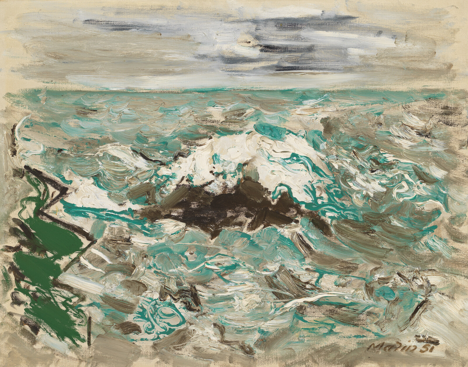 Rough teal and white waves crashing over dark rocks under a cloudy gray sky.