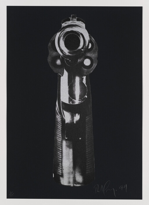A close-up of a revolver barrel pointing directly toward the viewer against a black background.