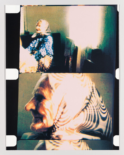 An elderly woman wearing a patterned headscarf sits on a couch and smiles in two film frames.