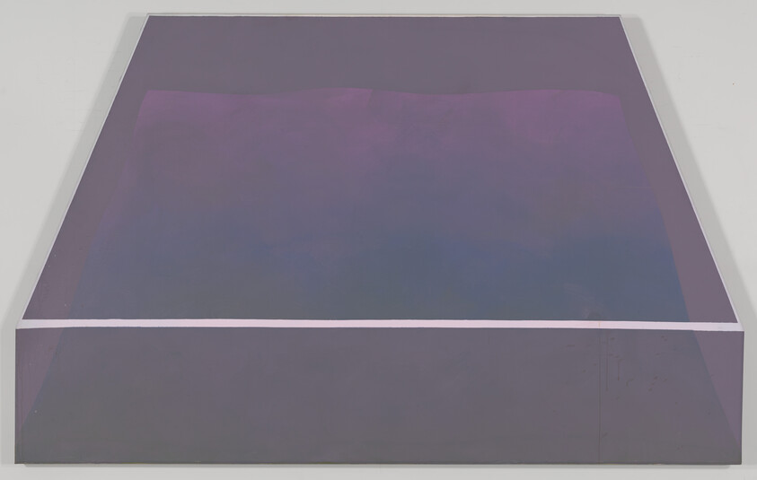 A large rectangular platform painted in muted purple tones with a thin white stripe across the front.