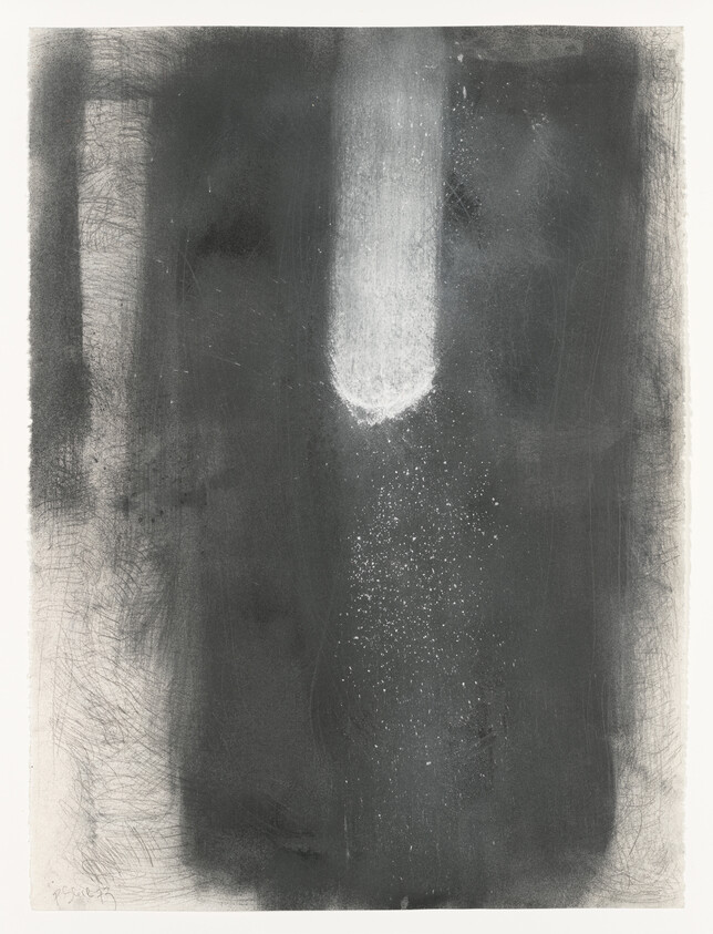 A dark vertical panel with a bright white streak at the top scattering small white specks downward.