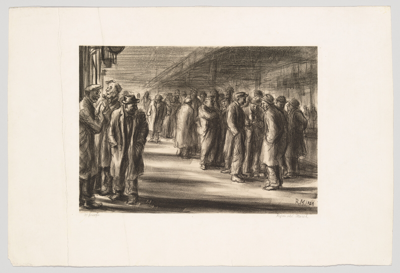 Men gathered on a dim train platform, standing in small groups and talking.