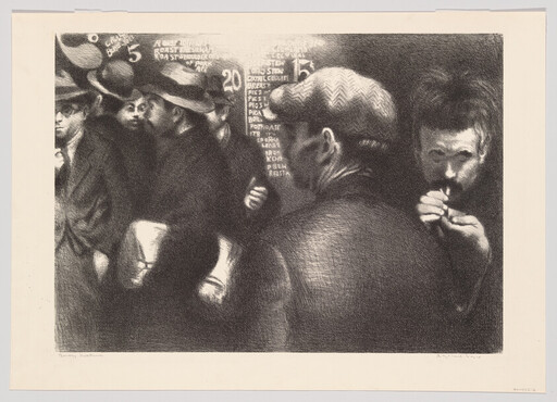 A group of men in hats crowd a dim room while one man lights a pipe.