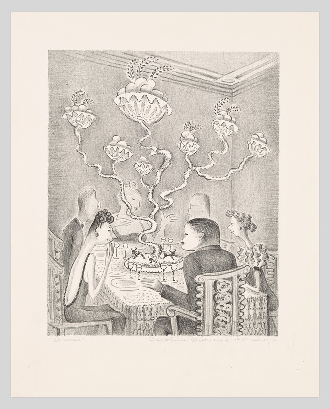 Diners sit around a table while a tall ornate chandelier with twisting branches rises above.