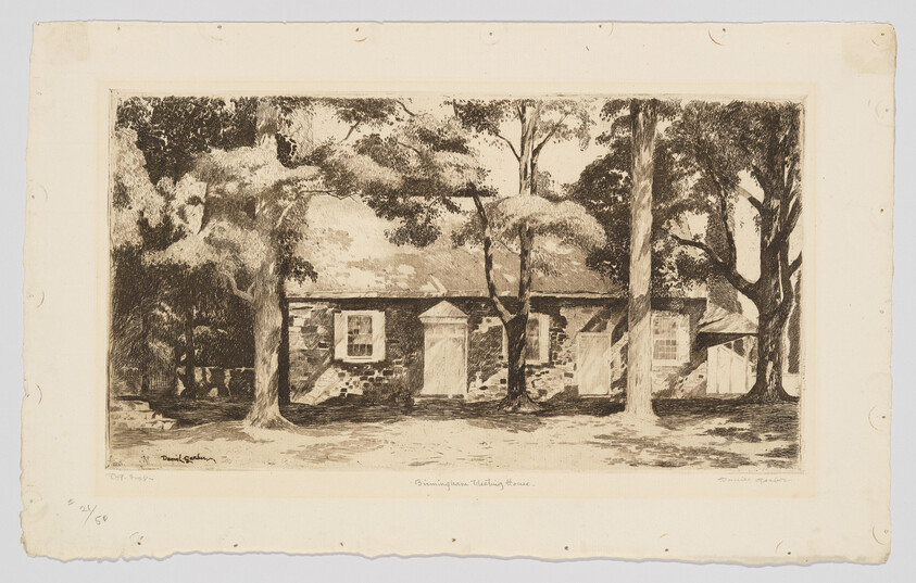Small stone house with central door shaded by large trees in the front yard.