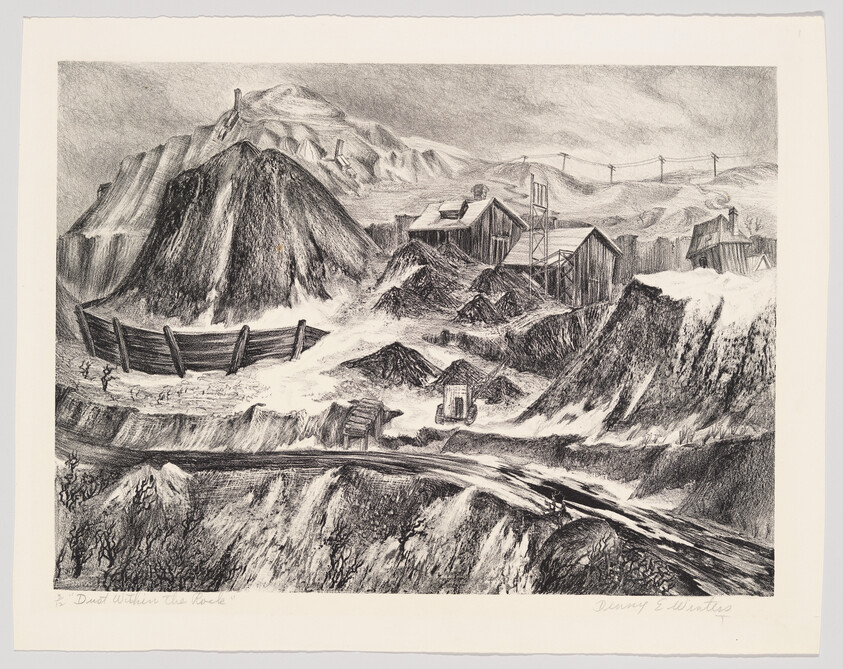 Abandoned mining site with tall slag heaps, wooden buildings, and railway tracks winding through.