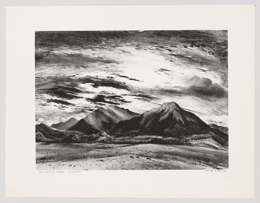 A wide black-and-white landscape shows rugged mountains under a sweeping cloudy sky above an open plain.