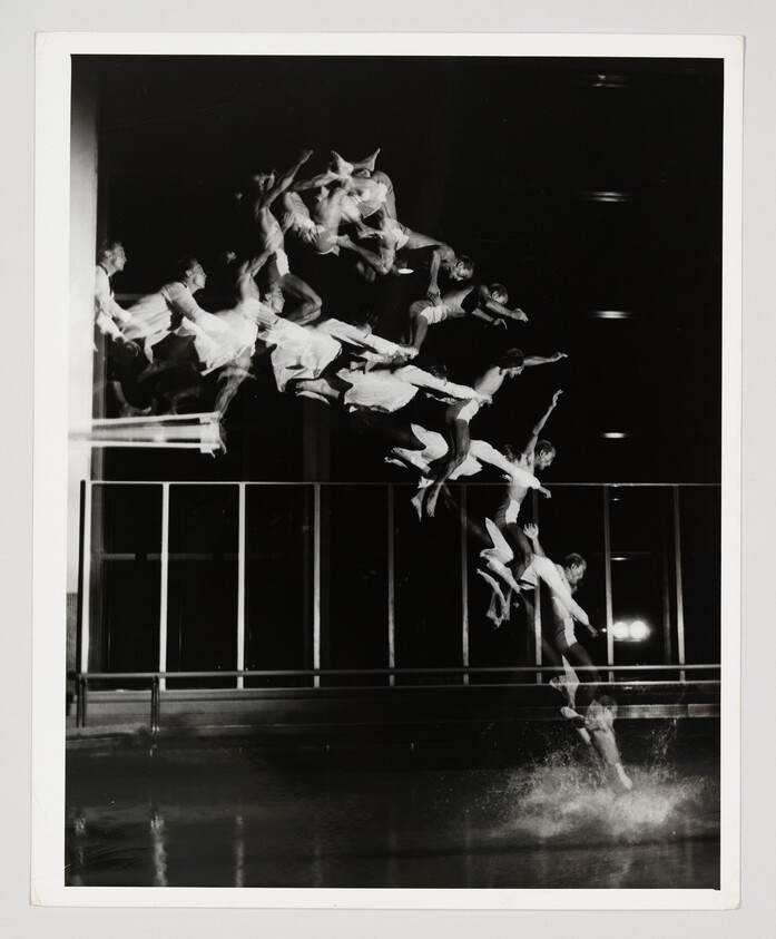 Man diving into a pool captured in multiple overlapping exposures showing his motion and splash.