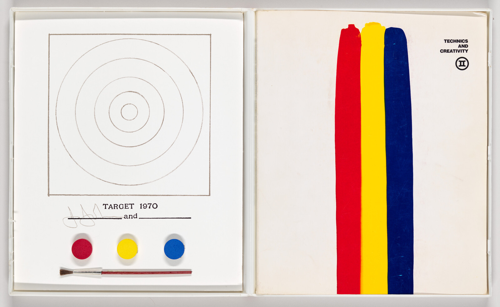 Open art book showing a target page with paint dots and brush and three vertical red, yellow, and blue stripes.