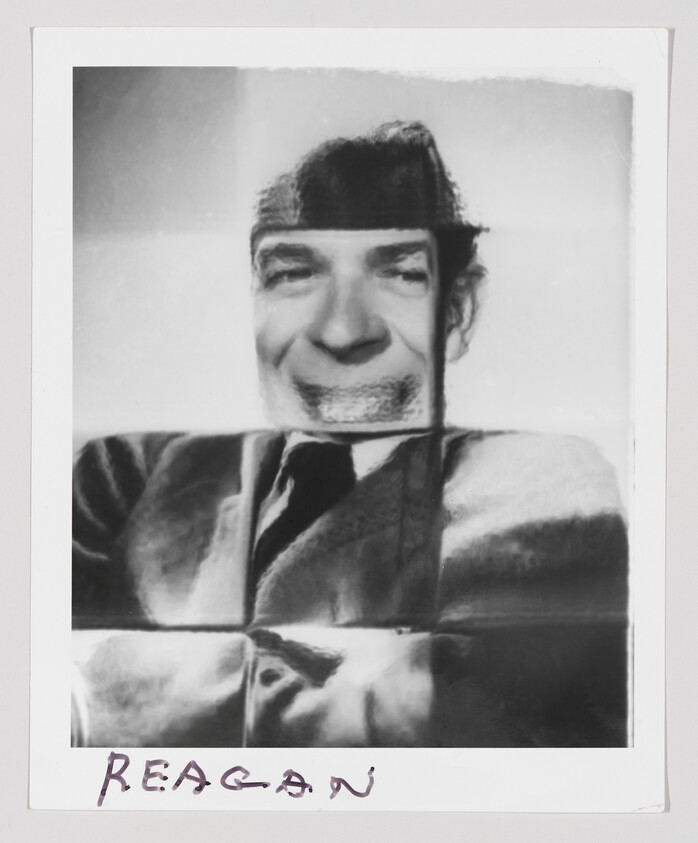 Distorted black-and-white portrait assembled from folded paper squares with handwritten name at bottom.