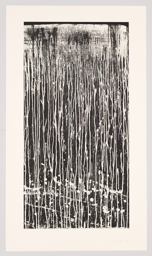 Tall black panel with thin white paint drips running vertically and scattered splatters.