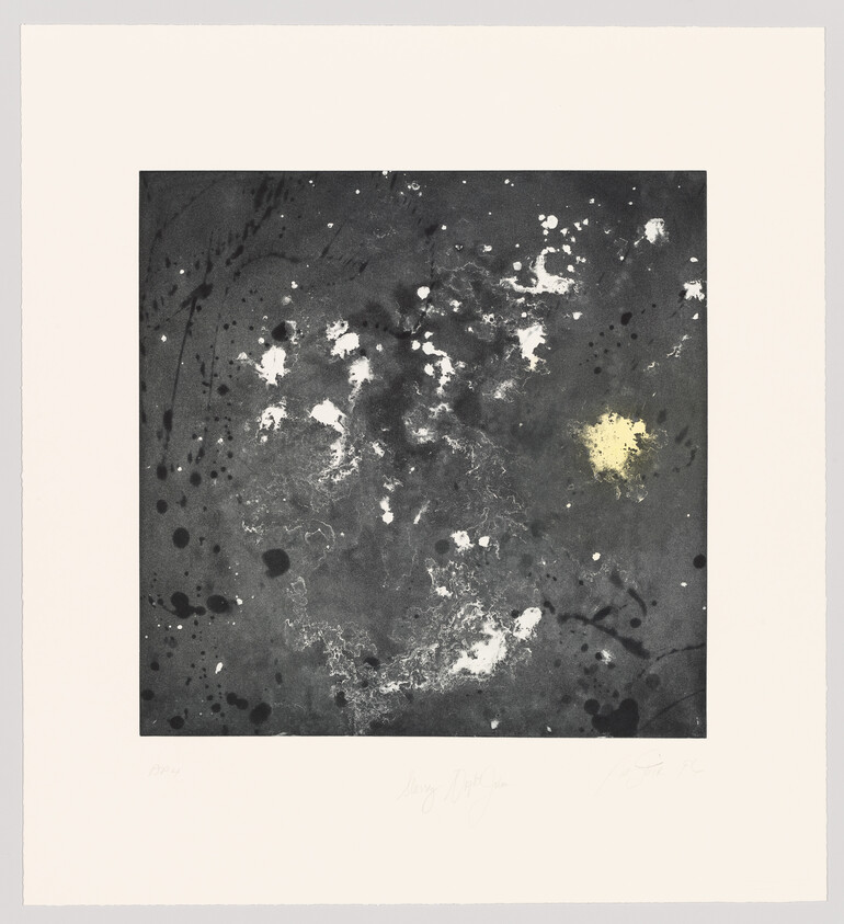 An abstract art print featuring a chaotic arrangement of black, white, and gray splatters and smudges, with a small, bright yellow accent in the lower right quadrant. The artwork is centered on a white background with artist's signatures and edition number at the bottom.