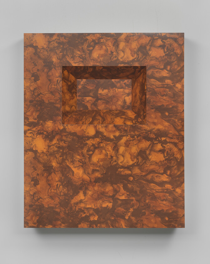 Rectangular brown marbled panel mounted on wall with a recessed rectangular cavity near the top.