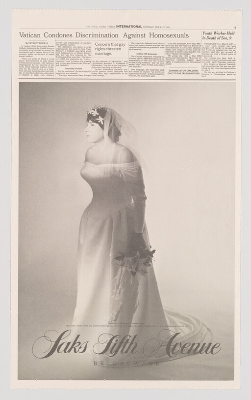 Bridal model in strapless wedding gown holding bouquet with "Saks Fifth Avenue" logo below.