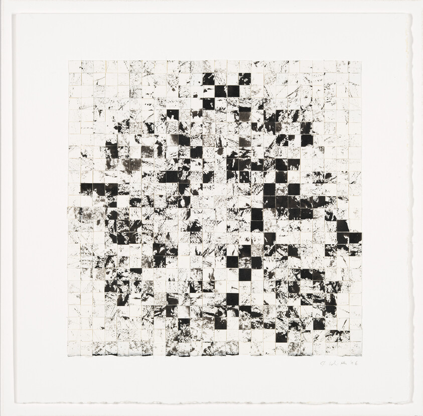 A black-and-white grid of small squares with scattered ink smudges creating an irregular checkerboard pattern.