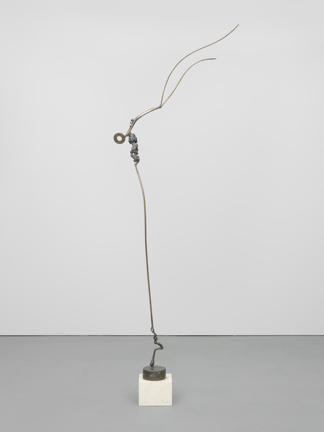 Thin tall metal sculpture with curved wires and a looped element standing on a small square base.