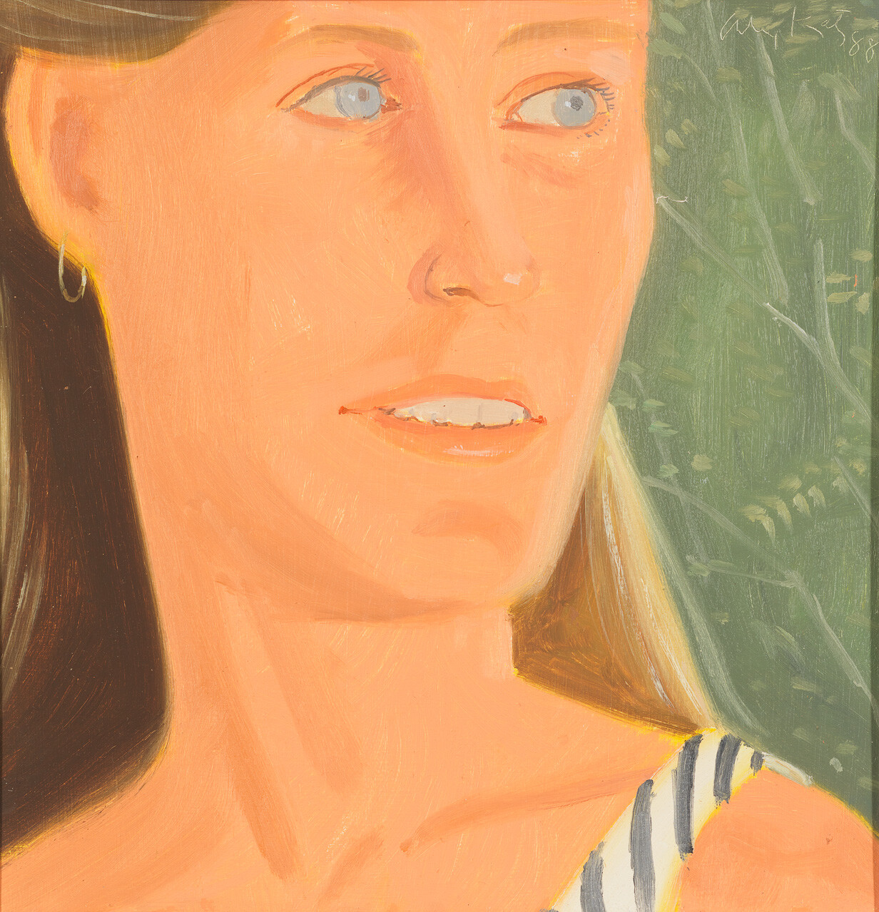 Woman with light blue eyes looking to the right while wearing a striped top and hoop earring.