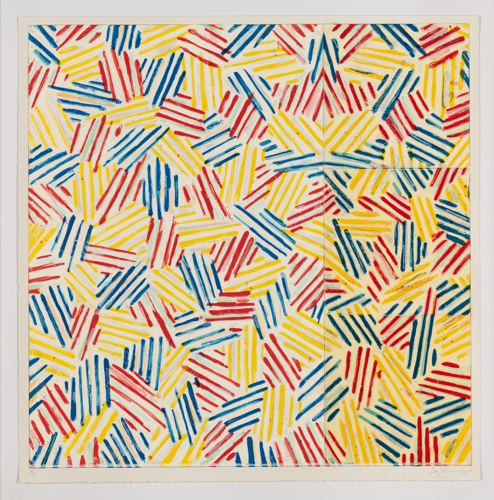 Dense pattern of short red, blue, and yellow angled stripes arranged in overlapping geometric clusters.