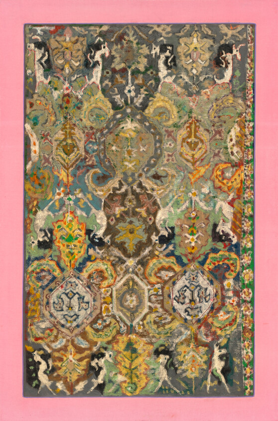 Ornate patterned rug with colorful floral and geometric motifs on a pink background.