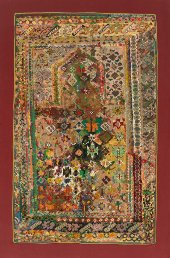 Worn colorful oriental rug with intricate geometric and floral patterns centered on a red background.