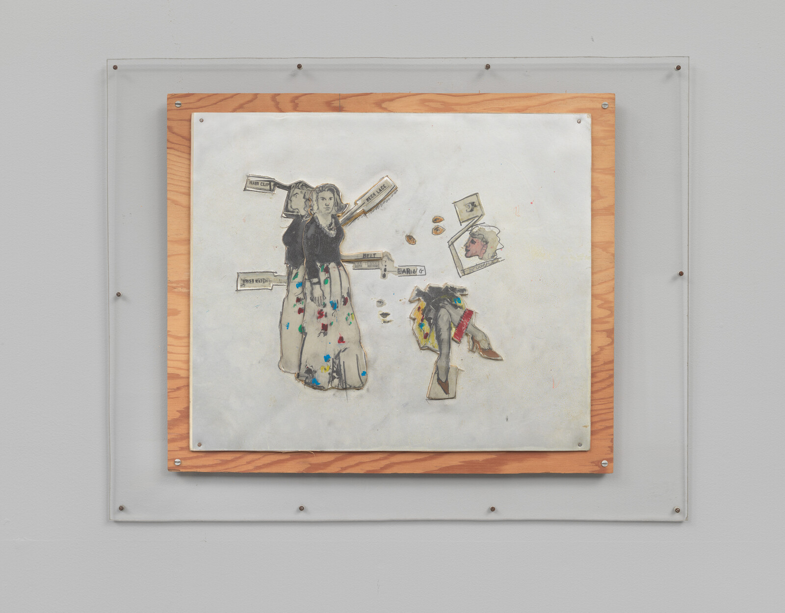 Framed mixed-media artwork showing a labeled drawing of a woman and scattered collage pieces.