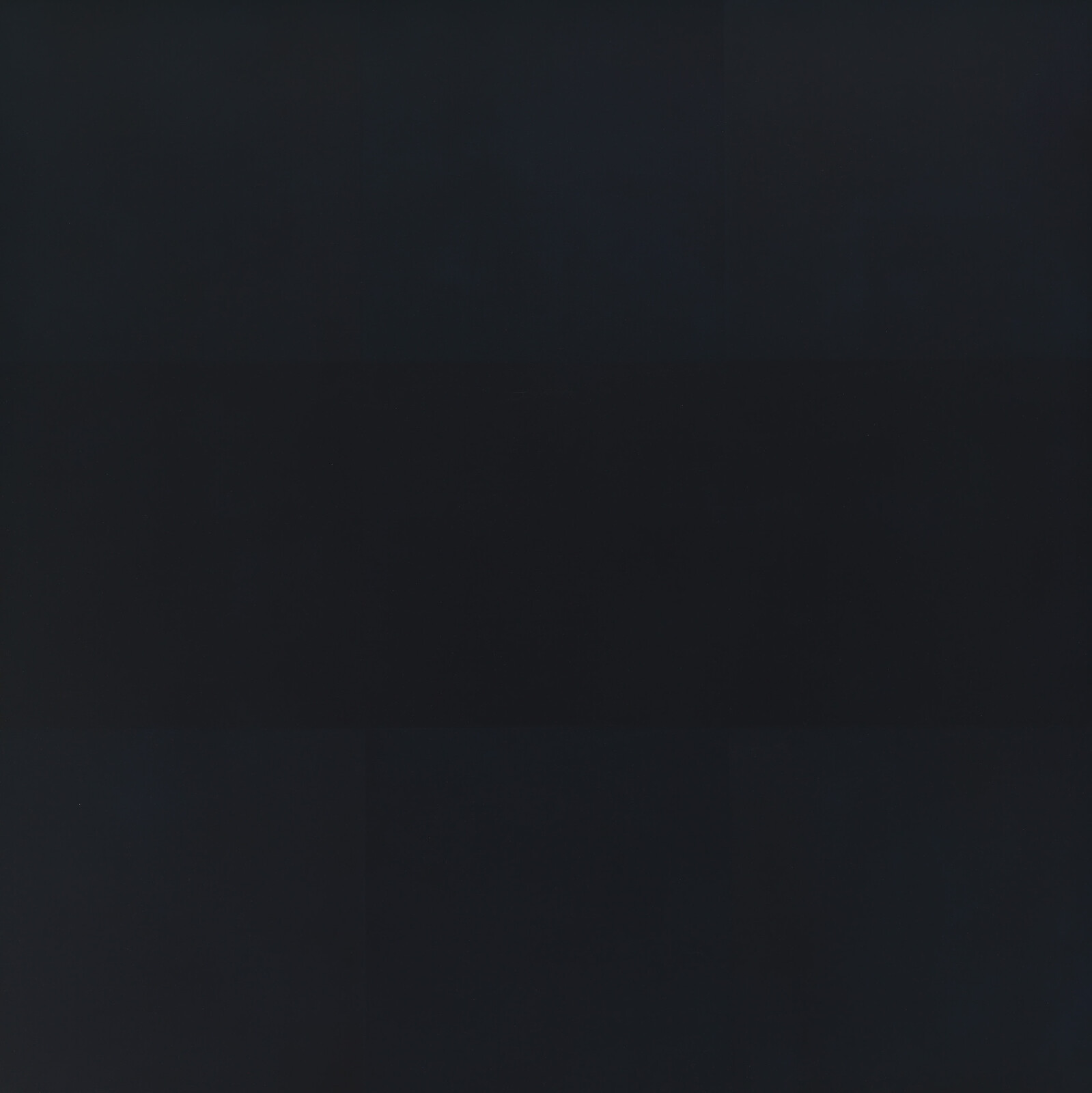 Dark gray square grid panel with subtle tonal variations across a mostly black surface.