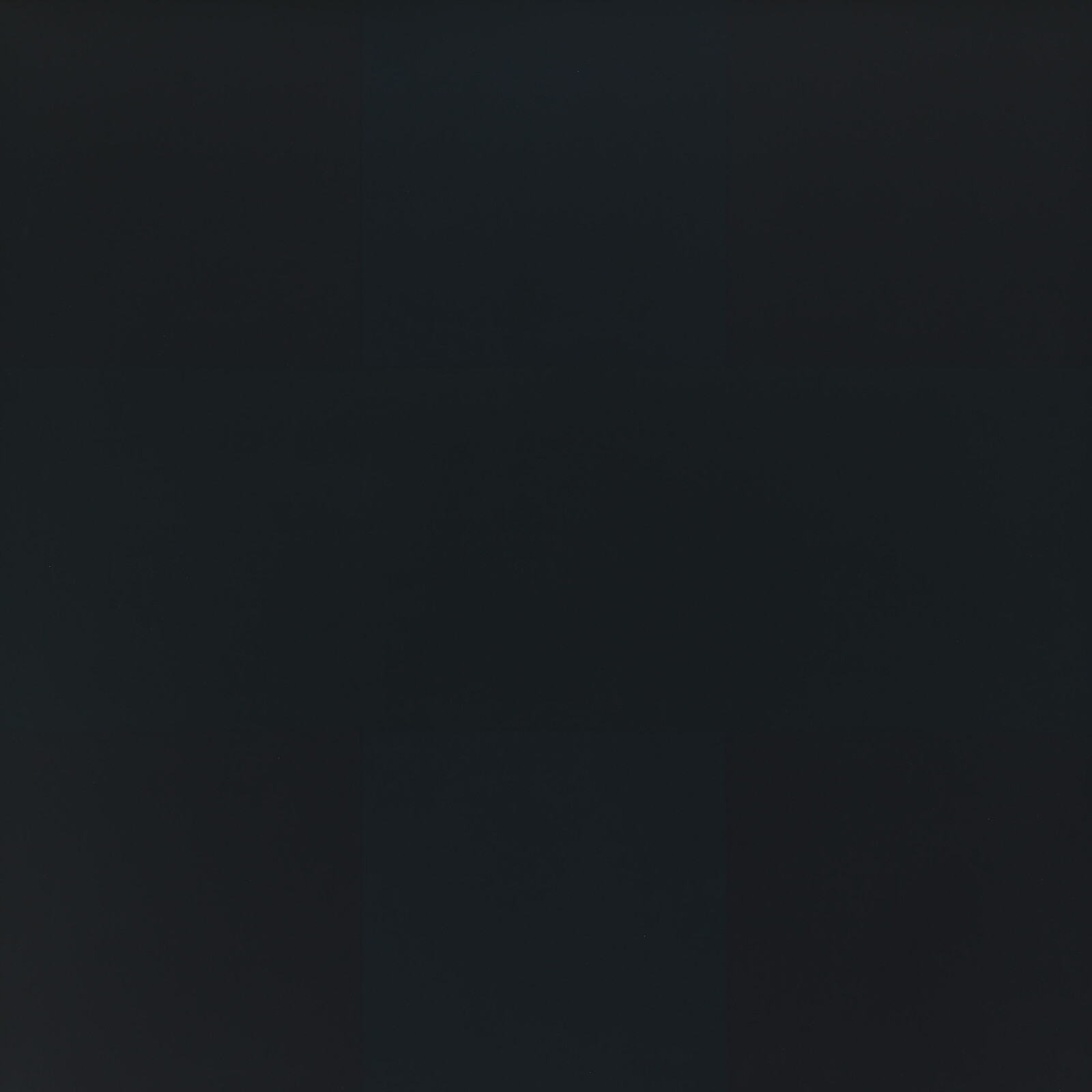 A dark gray square with subtle vertical and horizontal grid-like shading across the surface.