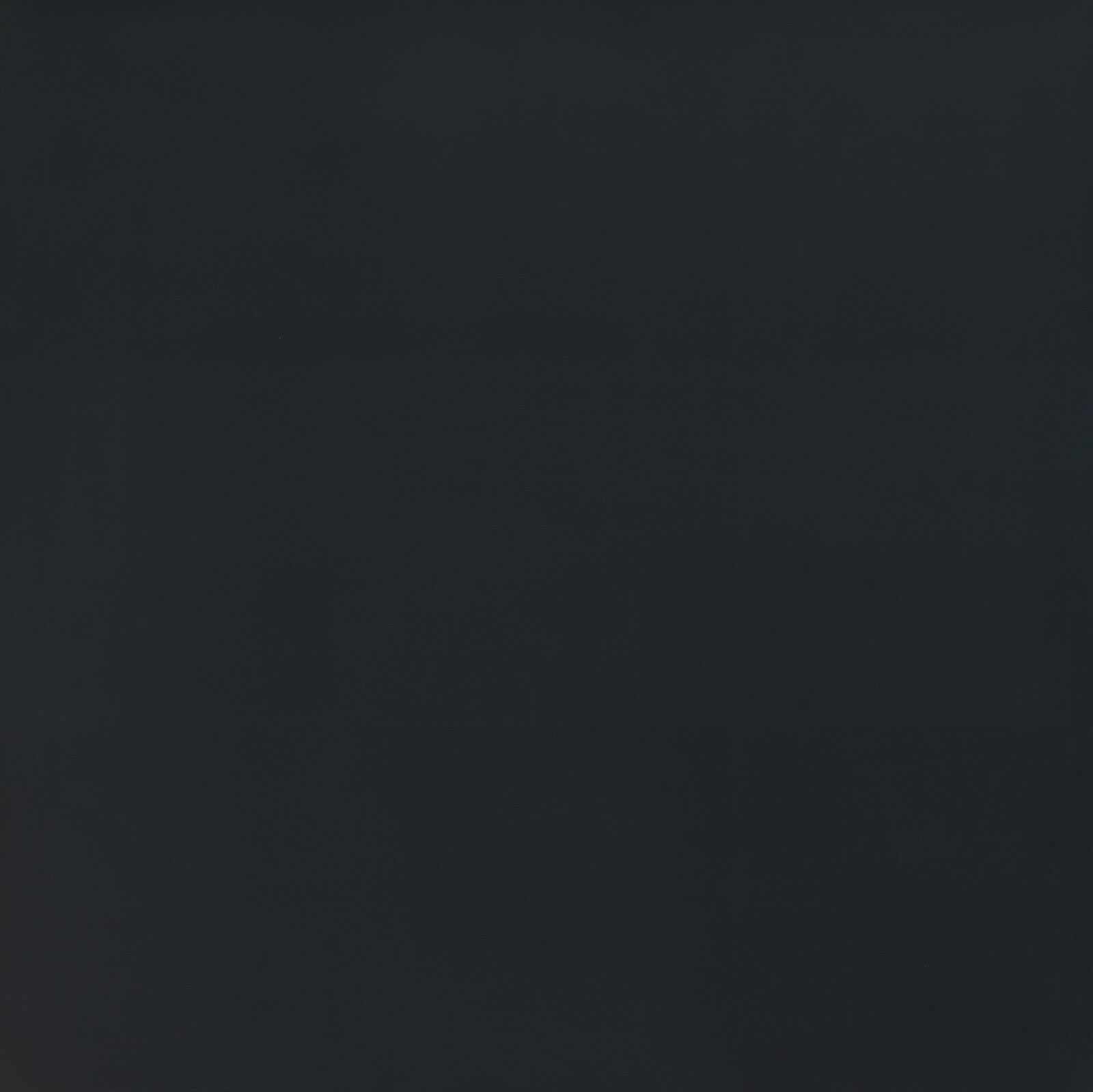 Solid dark gray surface with subtle variations and faint horizontal lines across it.