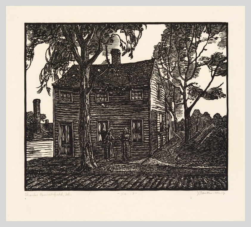 An old wooden two-story house with two people standing and talking beneath large trees.