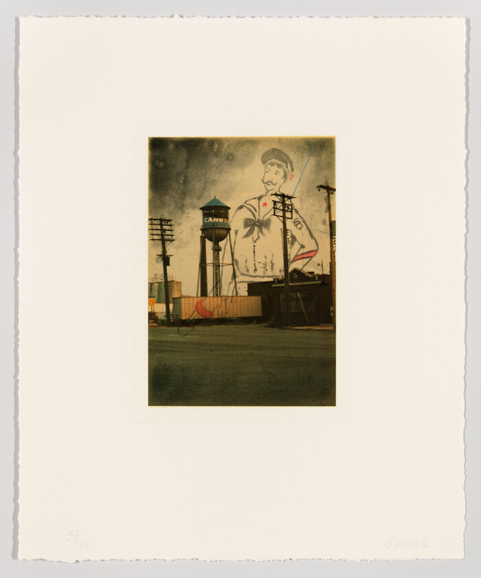 A tall water tower labeled "CANDY" stands beside a warehouse beneath a faded mural of a sailor.