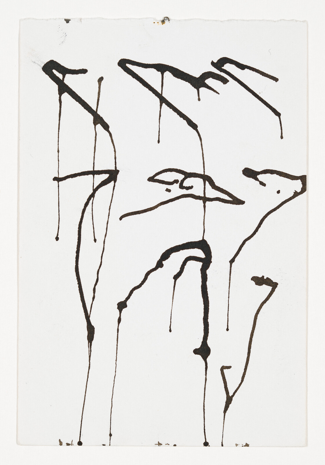 Black ink drips form tall, birdlike shapes and thin vertical lines on white paper.