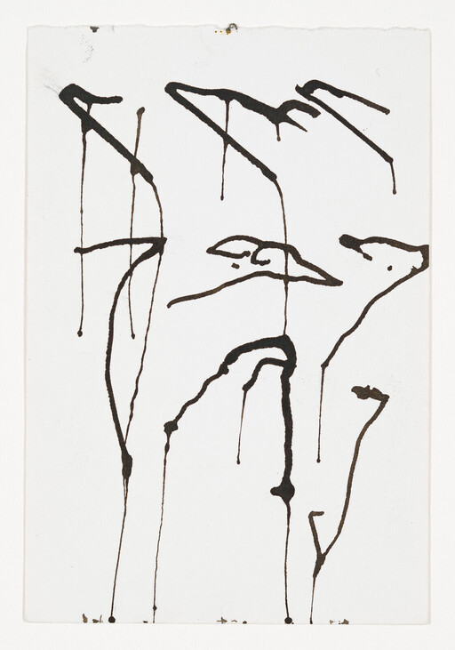 Black ink drips form tall, birdlike shapes and thin vertical lines on white paper.