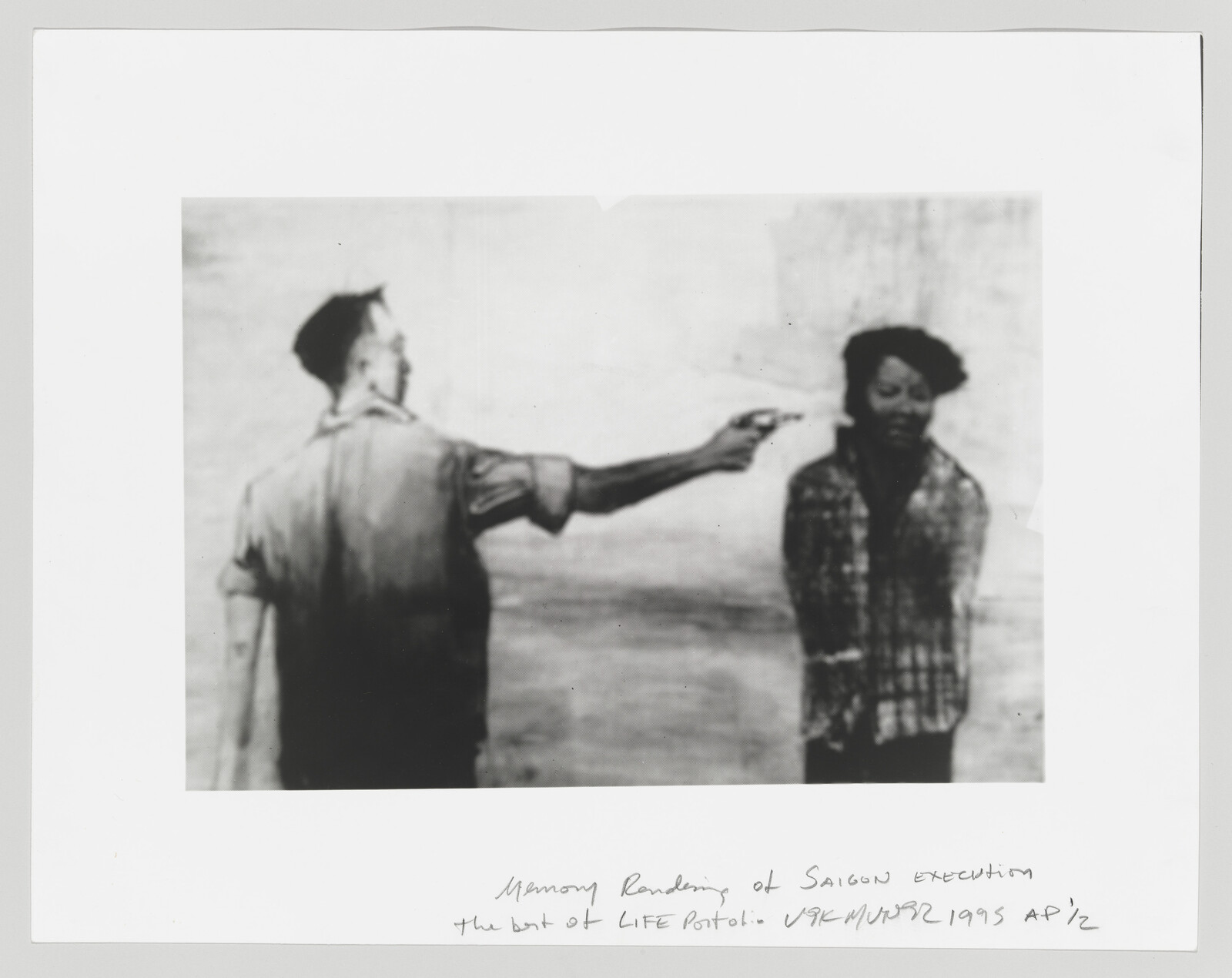 A soldier shoots a bound civilian at close range during an execution scene.