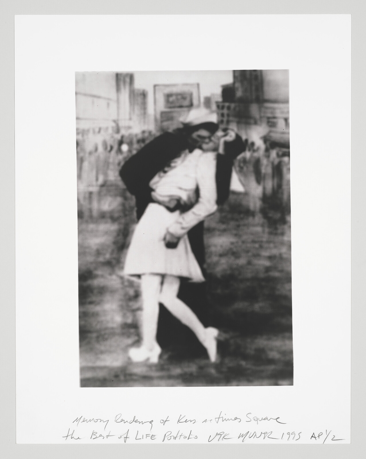 A sailor passionately kisses a nurse in a joyful embrace on a crowded city street.