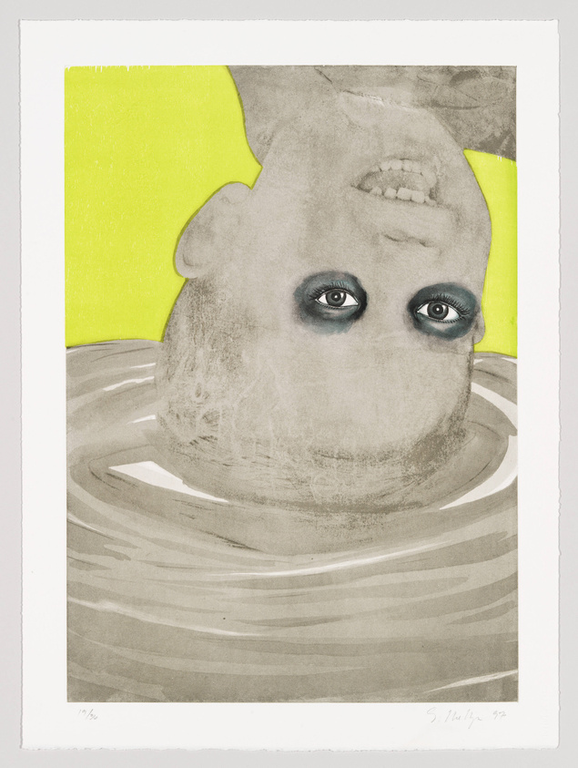 A surreal artwork featuring an upside-down head with prominent blue eyes and visible teeth against a background with a bright yellow corner and gray wavy lines below. The image has a hand-drawn quality and includes a signature and date in the bottom right corner.