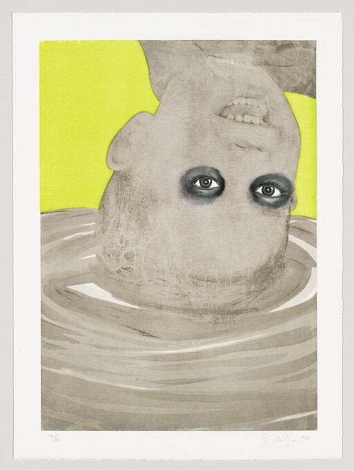 Upside-down head with dark eye makeup partially submerged in rippling water against a yellow background.