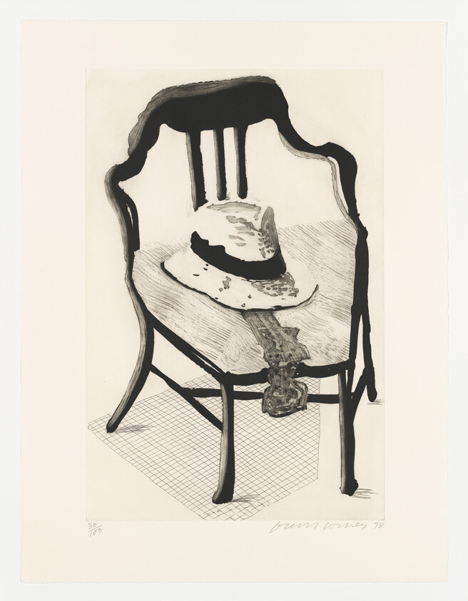 A black and white print depicting a melting clock draped over the edge of a simple, dark chair, which is placed on a checkered floor. The artwork has a surreal quality, and there is a signature at the bottom right corner.