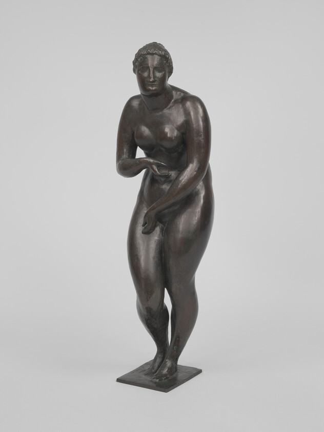 Bronze sculpture of a standing nude woman modestly covering her chest and abdomen.