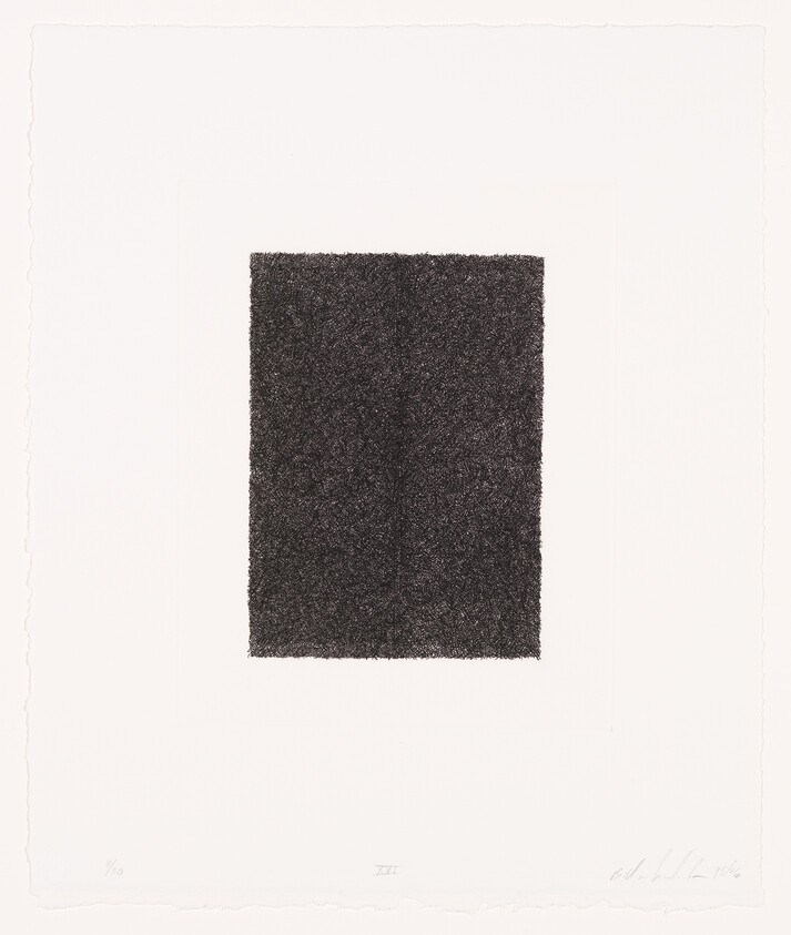 A dense textured black rectangle centered on white paper with deckled edges.