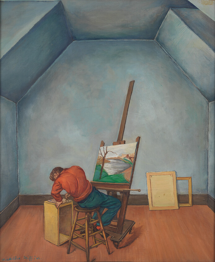 A person in a red shirt leans over a box in a blue-walled room with a painting.